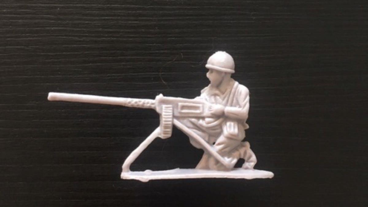 a gray plastic toy soldier