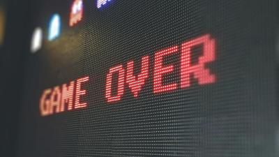 Image of a video game screen that reads "Game Over" in red letters.