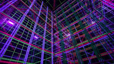 An exhibit at Otherworld Philadelphia. A colorful, immersive display of threads hanging from the ceiling