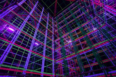 An exhibit at Otherworld Philadelphia. A colorful, immersive display of threads hanging from the ceiling